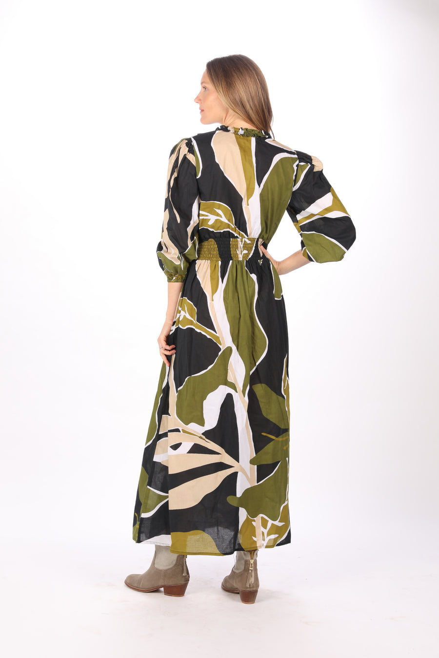 Back view of Bindu Pia Dress Black Olive fall cotton maxi dress with long sleeves and front slit